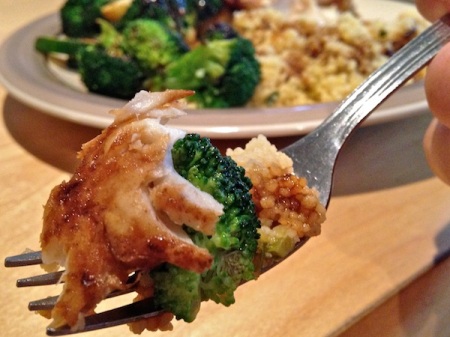 close-up-fork-poached-hake-couscous-broccoli